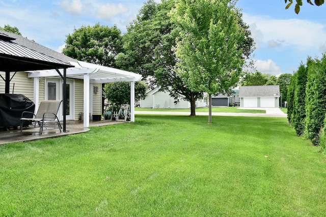 705 14th St, Wabasha, MN 55981 - view of green lawn with a pergola, a patio, and a garage