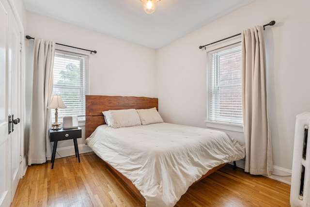 3409 Emerson Ave S Unit 4, Minneapolis, MN 55408 - bedroom with light wood finished floors and baseboards