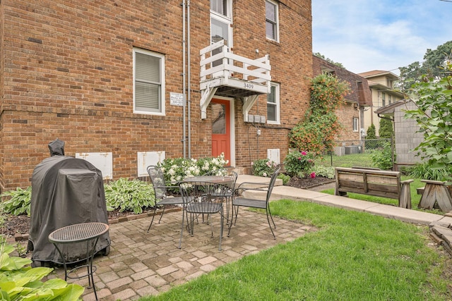 3409 Emerson Ave S Unit 4, Minneapolis, MN 55408 - view of patio with a grill, outdoor dining space, and a balcony