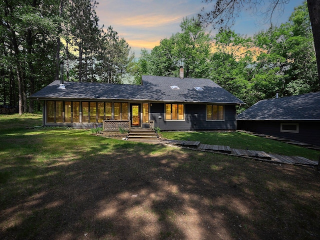 3709 Half Moon Cir, Jackson Twp, WI 54830 - view of front of house featuring a front lawn and a chimney