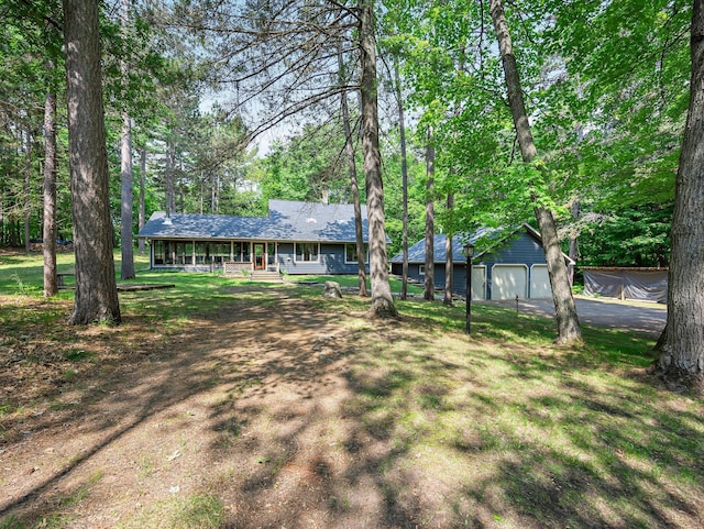 3709 Half Moon Cir, Jackson Twp, WI 54830 - ranch-style home featuring a porch, an outbuilding, asphalt driveway, a front yard, and a garage