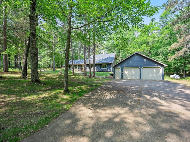3709 Half Moon Cir, Jackson Twp, WI 54830 - single story home featuring a garage, an outbuilding, and a front lawn