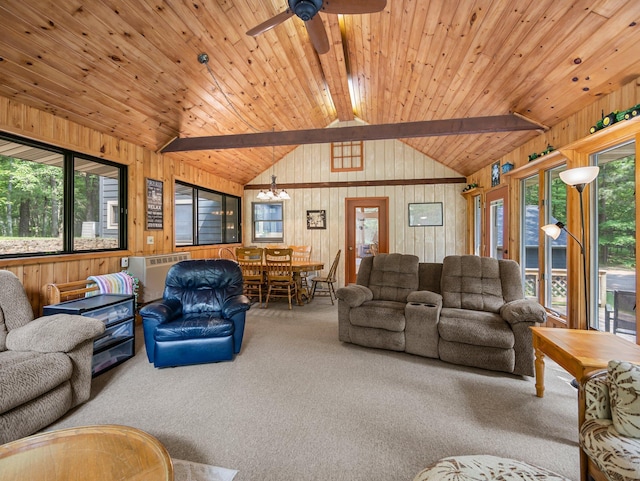 3709 Half Moon Cir, Jackson Twp, WI 54830 - carpeted living room featuring plenty of natural light, wooden walls, and a ceiling fan