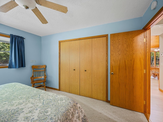 3709 Half Moon Cir, Jackson Twp, WI 54830 - bedroom featuring a textured ceiling, a ceiling fan, and carpet