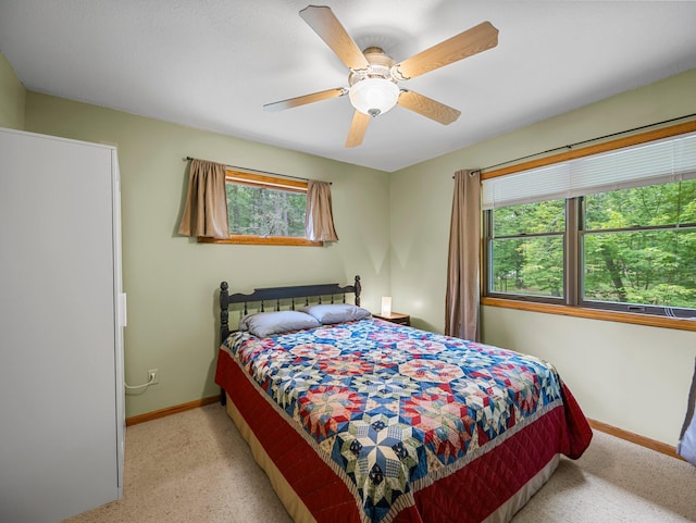 3709 Half Moon Cir, Jackson Twp, WI 54830 - carpeted bedroom with baseboards and ceiling fan