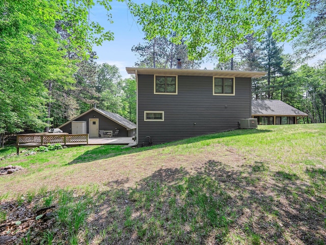 3709 Half Moon Cir, Jackson Twp, WI 54830 - back of house featuring a deck and a yard