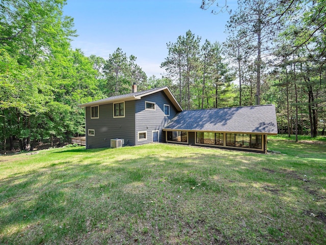 3709 Half Moon Cir, Jackson Twp, WI 54830 - back of property with a chimney and a yard