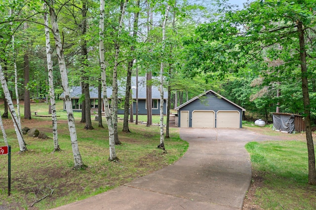 3709 Half Moon Cir, Jackson Twp, WI 54830 - view of front of house featuring a detached garage and an outbuilding
