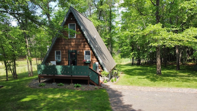 76683 Long Lake Rd, Kettle River Twp, MN 55795 - a-frame home with a front yard, roof with shingles, and a wooden deck