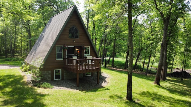 76683 Long Lake Rd, Kettle River Twp, MN 55795 - view of front facade featuring a wooden deck and a front yard