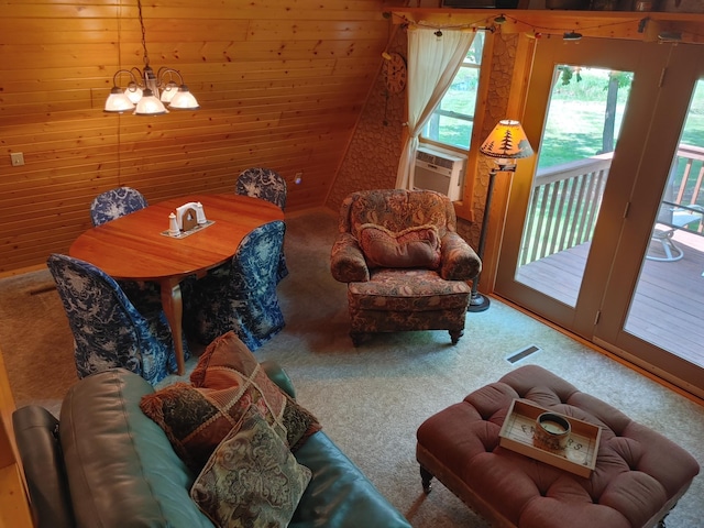 76683 Long Lake Rd, Kettle River Twp, MN 55795 - living area with carpet floors, a chandelier, wooden walls, and cooling unit