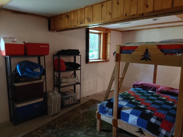 76683 Long Lake Rd, Kettle River Twp, MN 55795 - bedroom featuring concrete block wall and concrete floors
