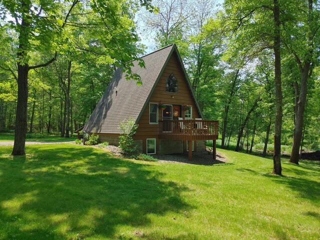 76683 Long Lake Rd, Kettle River Twp, MN 55795 - rear view of property featuring a wooden deck and a lawn