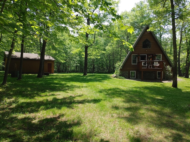 76683 Long Lake Rd, Kettle River Twp, MN 55795 - view of green lawn with a deck