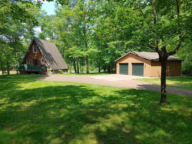 76683 Long Lake Rd, Kettle River Twp, MN 55795 - view of property exterior with a lawn, an outdoor structure, and a detached garage