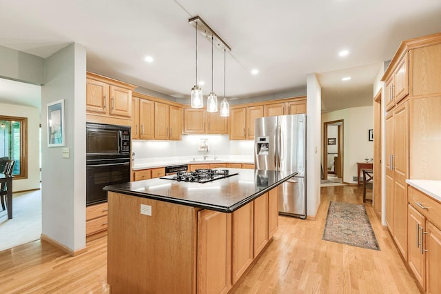 5 Anemone Cir, North Oaks, MN 55127 - kitchen featuring black appliances, light brown cabinets, a center island, light wood finished floors, and a sink