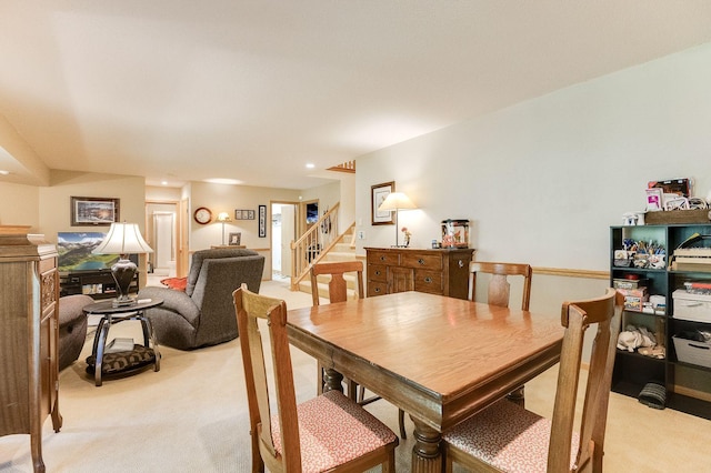 5 Anemone Cir, North Oaks, MN 55127 - dining area with light colored carpet, stairs, and recessed lighting