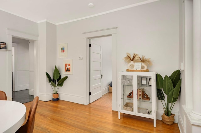 681 Dayton Ave, Saint Paul, MN 55104 - living area featuring crown molding, light wood-style floors, and baseboards