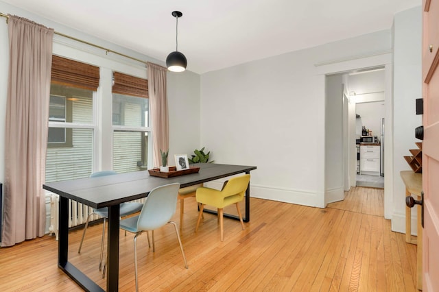 681 Dayton Ave, Saint Paul, MN 55104 - dining room with light wood-style flooring and baseboards