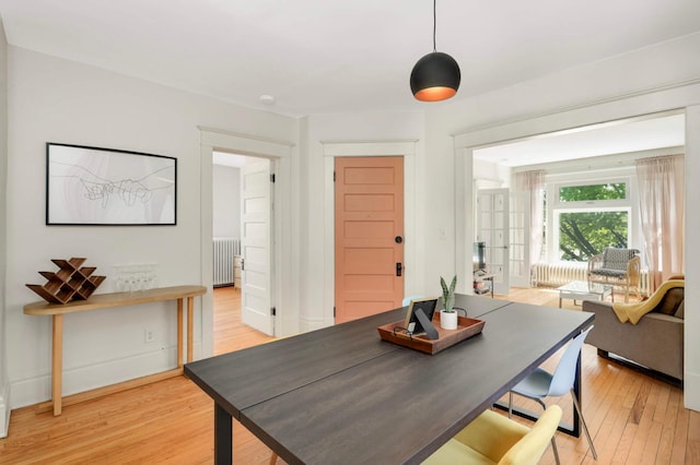 681 Dayton Ave, Saint Paul, MN 55104 - dining space with radiator, light wood-style floors, and baseboards