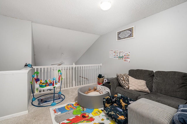 13525 Partridge Cir NW, Andover, MN 55304 - game room with carpet floors, ceiling fan, vaulted ceiling, baseboards, and a textured ceiling