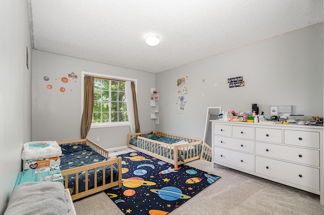 13525 Partridge Cir NW, Andover, MN 55304 - carpeted bedroom featuring a textured ceiling and a crib