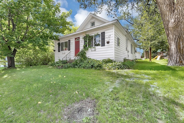 17 Riverside Ave S, Sartell, MN 56377 - view of front of house featuring a playground, entry steps, and a front lawn