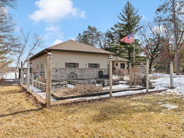 9174 Aloha Ln, Pelican Twp, MN 56472 - snow covered rear of property with a garden