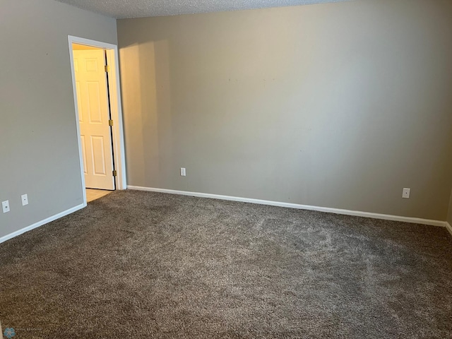 358 30th St N, Moorhead, MN 56560 - carpeted empty room featuring baseboards and a textured ceiling