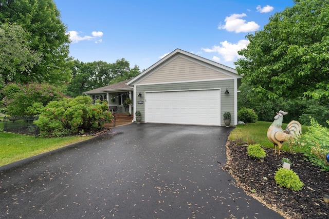 2146 84th Ave, Osceola, WI 54020 - ranch-style house with asphalt driveway and an attached garage