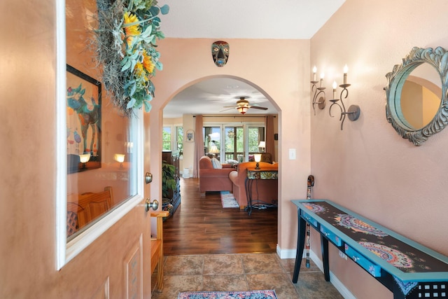 2146 84th Ave, Osceola, WI 54020 - entrance foyer featuring arched walkways, a ceiling fan, and baseboards