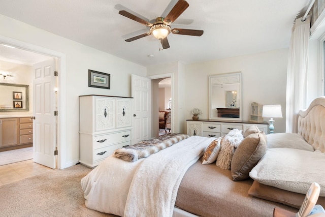 2146 84th Ave, Osceola, WI 54020 - bedroom with arched walkways, baseboards, ensuite bathroom, and ceiling fan