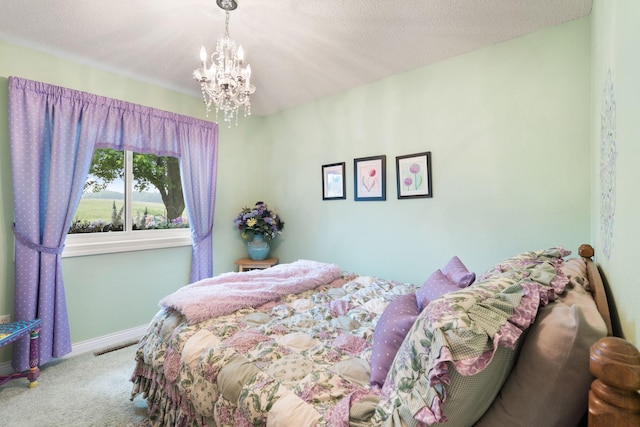 2146 84th Ave, Osceola, WI 54020 - bedroom with carpet floors, a chandelier, and baseboards