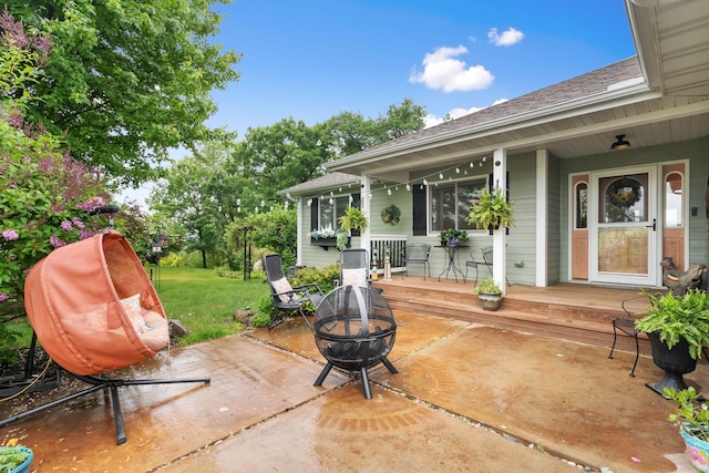 2146 84th Ave, Osceola, WI 54020 - porch featuring an outdoor fire pit and a yard