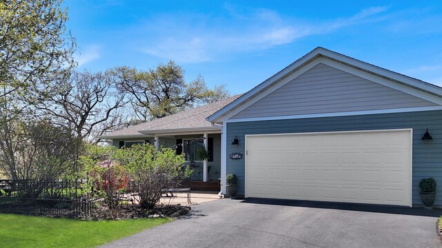 2146 84th Ave, Osceola, WI 54020 - single story home with an attached garage, asphalt driveway, and a shingled roof