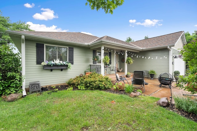 2146 84th Ave, Osceola, WI 54020 - single story home featuring a fire pit, a porch, a front lawn, a garage, and a shingled roof