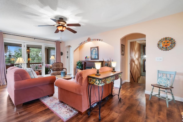 2146 84th Ave, Osceola, WI 54020 - living area featuring arched walkways, ceiling fan, dark wood-style floors, and baseboards