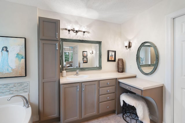 2146 84th Ave, Osceola, WI 54020 - bathroom featuring a garden tub, vanity, and a textured ceiling