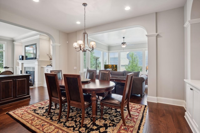 749 Fairway Dr, Medina, MN 55340 - dining room featuring arched walkways, ceiling fan, a glass covered fireplace, dark wood-style floors, and ornamental molding