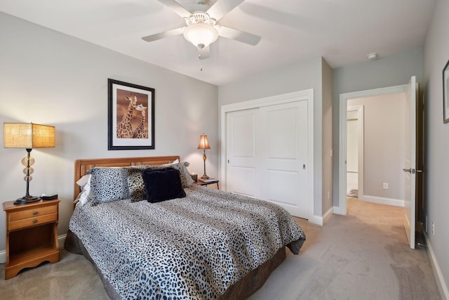 749 Fairway Dr, Medina, MN 55340 - bedroom featuring light carpet, a closet, baseboards, and ceiling fan