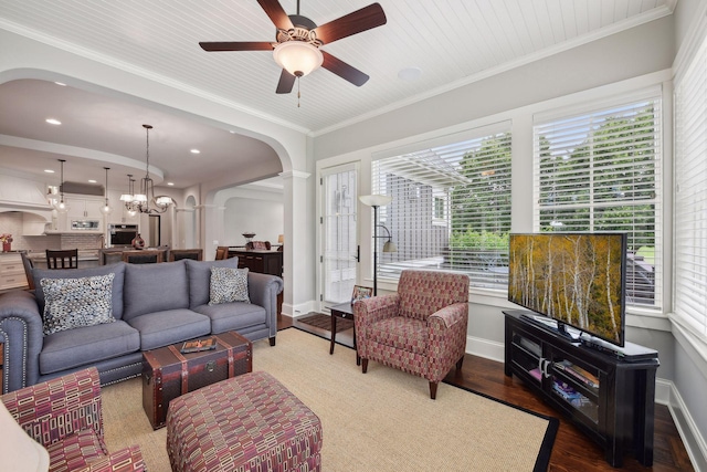 749 Fairway Dr, Medina, MN 55340 - living area with arched walkways, wood finished floors, a ceiling fan, baseboards, and crown molding