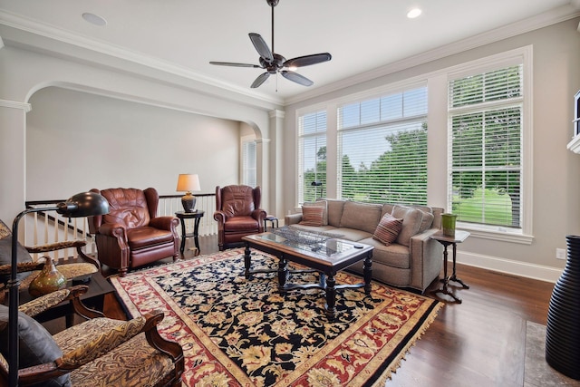 749 Fairway Dr, Medina, MN 55340 - living area featuring arched walkways, dark wood-style floors, a ceiling fan, baseboards, and crown molding