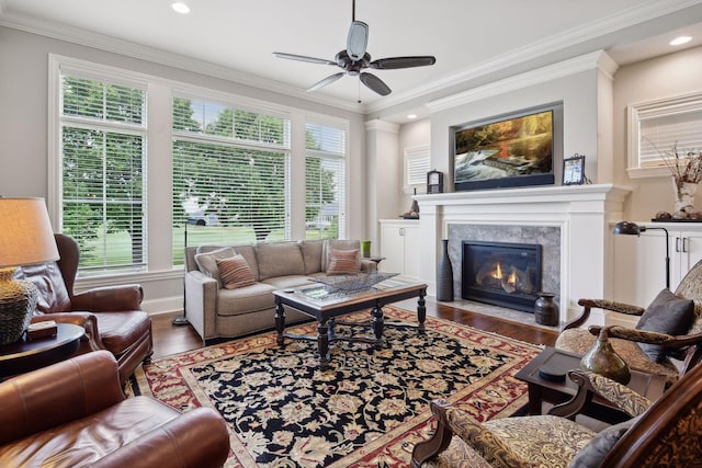 749 Fairway Dr, Medina, MN 55340 - living room with wood finished floors, a fireplace, a ceiling fan, ornamental molding, and recessed lighting