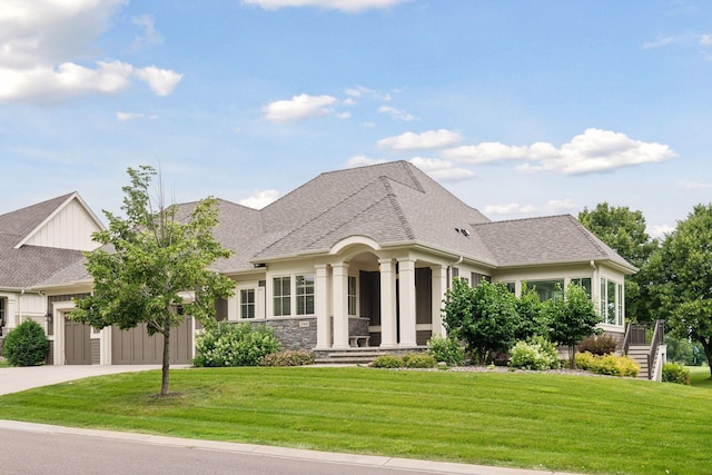749 Fairway Dr, Medina, MN 55340 - french country home with an attached garage, driveway, a front yard, a shingled roof, and stone siding