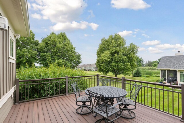 749 Fairway Dr, Medina, MN 55340 - deck with outdoor dining space, a yard, and a grill