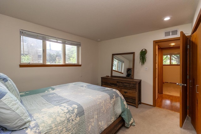1269 Cleveland Ave N Unit 2B, Saint Paul, MN 55108 - bedroom with light colored carpet, recessed lighting, and baseboards