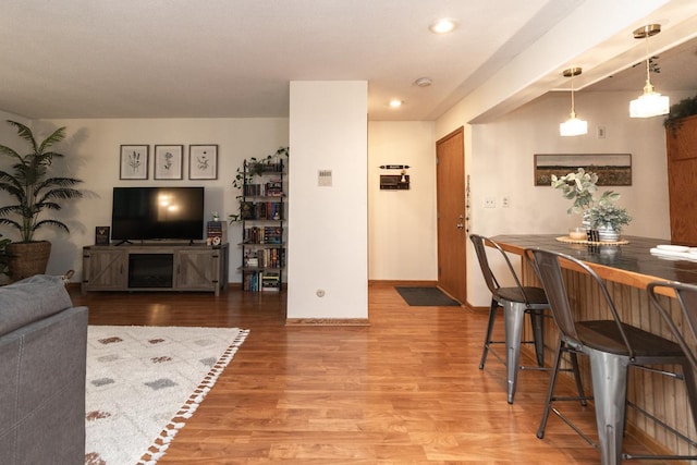 1269 Cleveland Ave N Unit 2B, Saint Paul, MN 55108 - living area with wood finished floors, baseboards, and recessed lighting