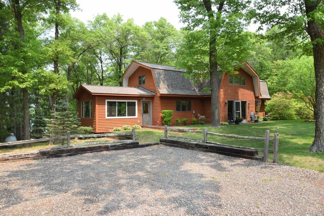 27625 Clear Sky Rd, Jackson Twp, WI 54893 - cabin featuring a gambrel roof, roof with shingles, and a front lawn