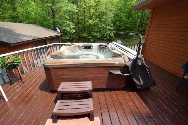 27625 Clear Sky Rd, Jackson Twp, WI 54893 - wooden deck featuring a hot tub and a view of trees