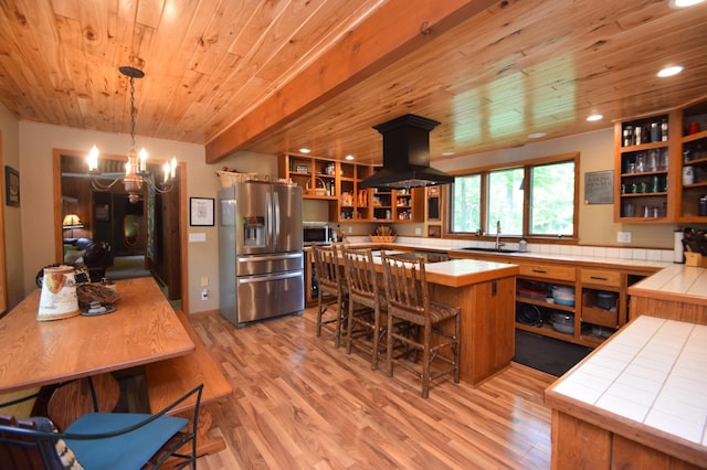 27625 Clear Sky Rd, Jackson Twp, WI 54893 - kitchen with stainless steel appliances, open shelves, island exhaust hood, wooden ceiling, and tile counters